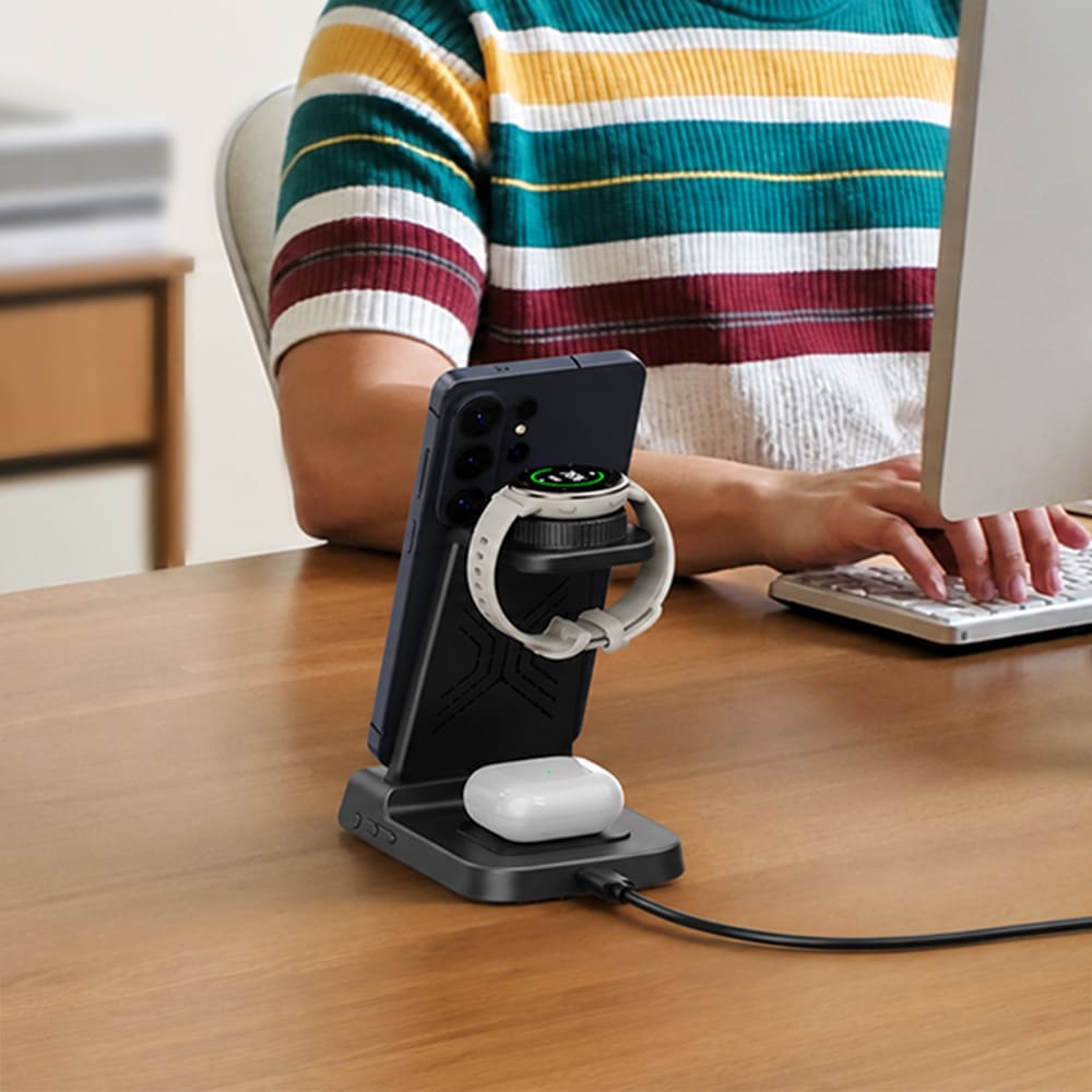 Garmin watch charger station on an office desk with phone and earbuds charging SwanScout C01GM